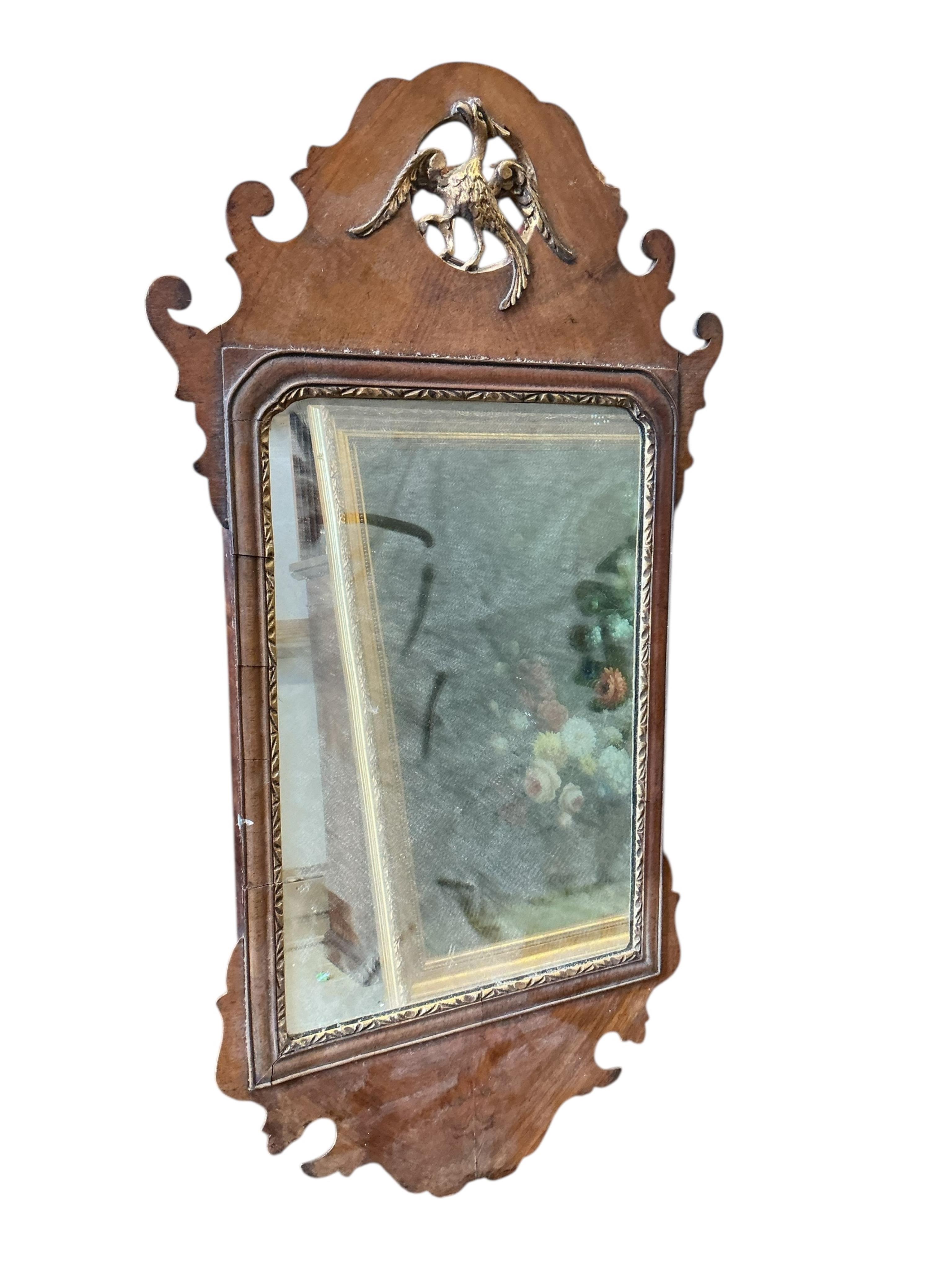 An 18th century style walnut and parcel gilt fret cut wall mirror, signed London, 1741, width 42cm, height 78cm